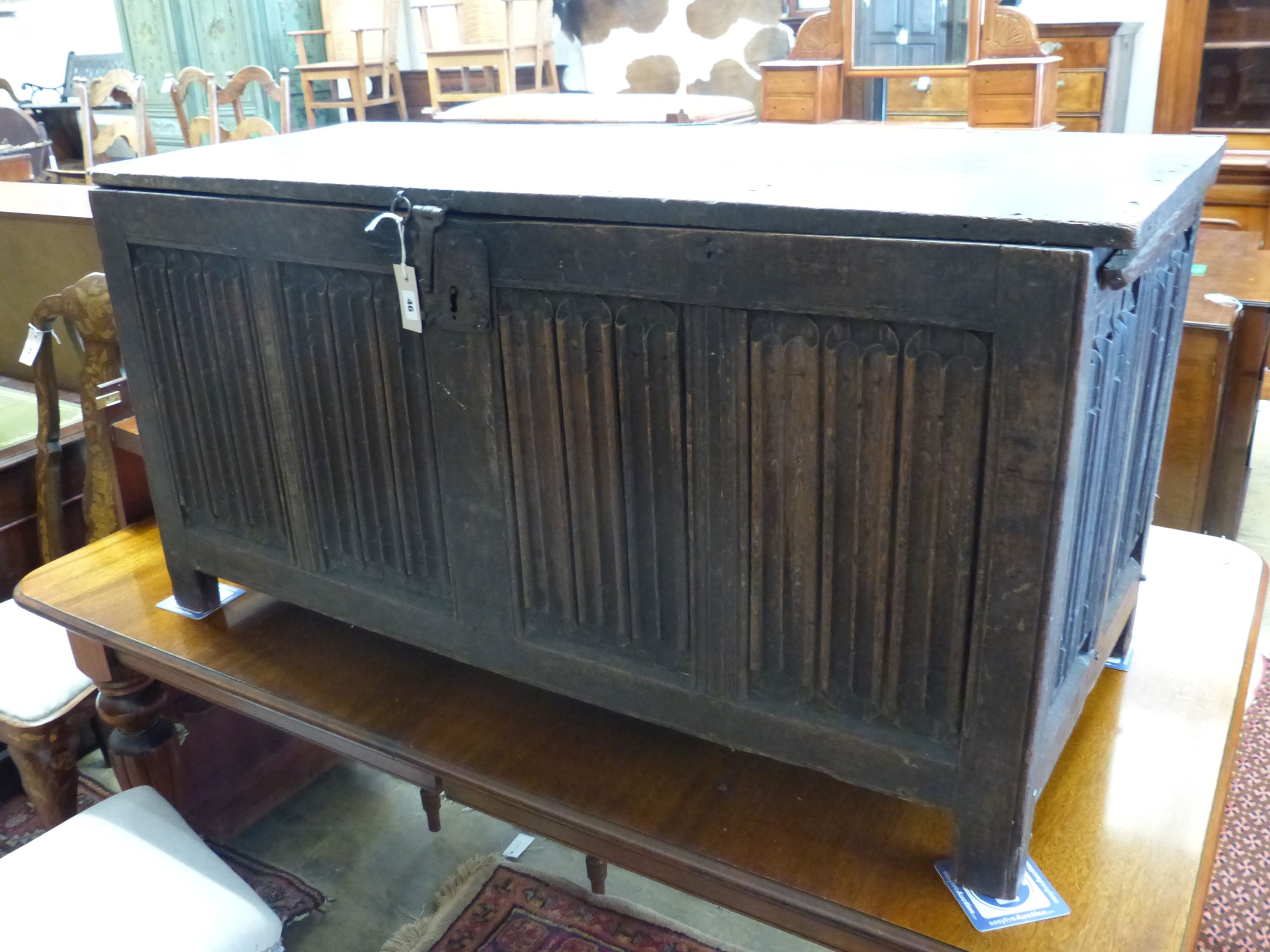 A carved and panelled oak chest, length 129cm, depth 51cm, height 63cm